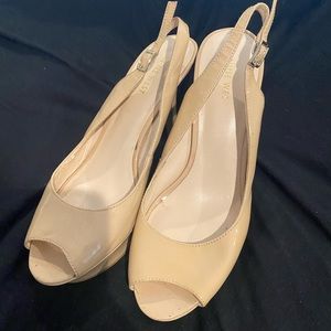 Nine West nude patent leather platform heels.